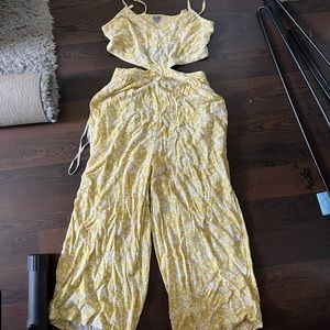 new with tags. yellow floral american eagle cutout jumpsuit